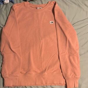 Pink The North Face crew neck. Good condition, lightly worn. Womens Medium.